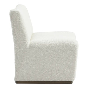 Side profile of the luxury white bouclé Beau armchair featuring luxurious white bouclé upholstery, soft contemporary curves and timeless designer styling for modern and coastal homes.