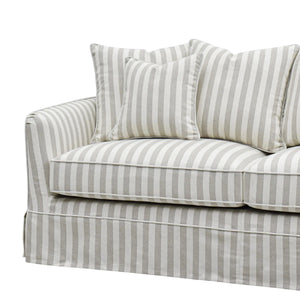 left side close up of thebNoosa Hamptons Stripe Sofa, a luxury slipcover sofa upholstered in beige and white striped fabric, designed for Hamptons, coastal, modern farmhouse and classic Australian living rooms.